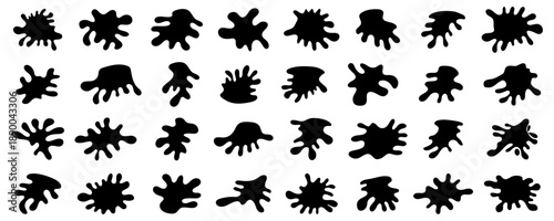 Ink splatter shapes collection in black. Abstract liquid blot forms with organic edges and irregular silhouettes