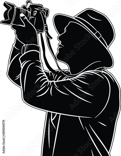 a stark silhouette depicts a photographer in a hat intently focused while operating a classic film camera capturing a moment