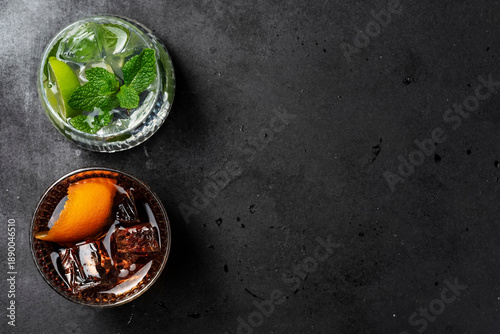 Mojito and Old Fashioned Cocktails Top View on Dark Stone Background