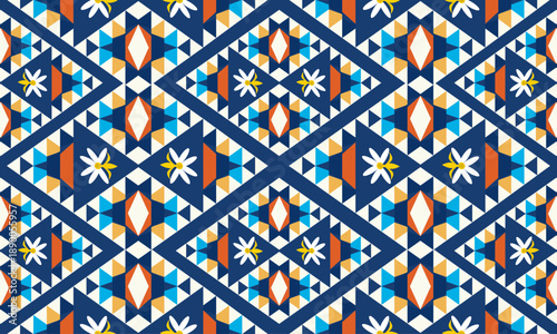 Seamless geometric floral pattern with diamond shapes and daisy motifs in navy blue, orange, yellow, and white, ideal for modern textiles, fabric, wallpaper, boho decor, and surface design.