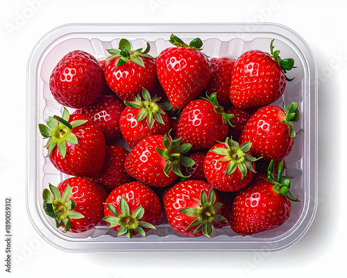 Overhead shot of a plastic strawberry container with lid slightly open, fresh red 
