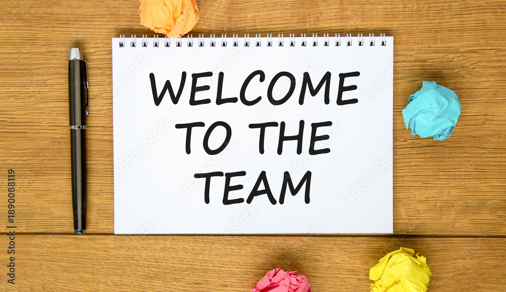 Fototapeta premium Support, help welcome to the team symbol. Concept words Welcome to the team on beautiful white note. Beautiful wooden background. Black pen. Business welcome to the team concept. Copy space.