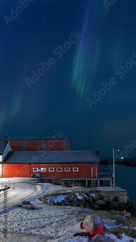 Northern lights above a boathouse. 9:16 Vertical 4K Time Lapse. Lofoten Islands, Northern Norway