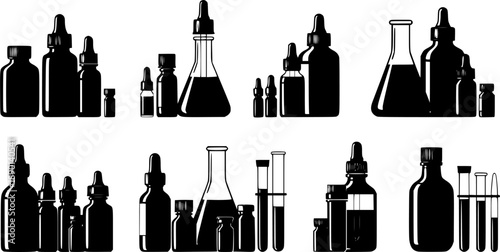 Various medical and laboratory bottles and vials on white background
