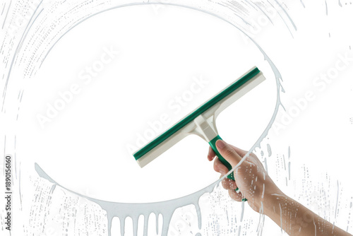 Hand using a squeegee to clean a soapy window, creating a clear circular path isolated on transparent background