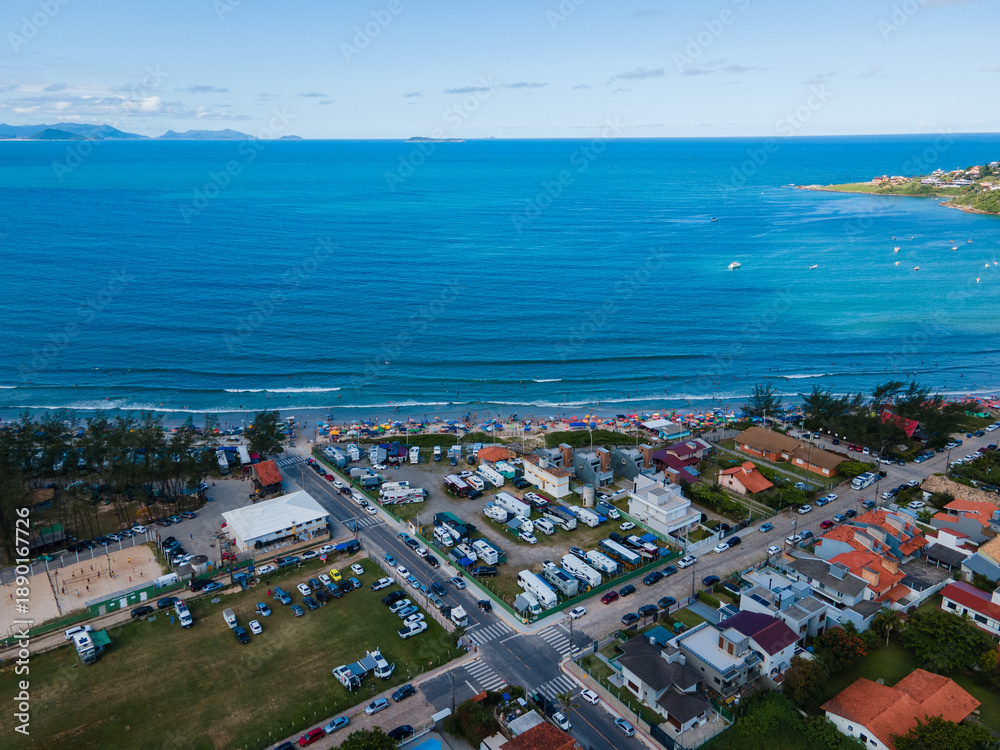 Fototapeta premium Aerial View of Beachfront Camping and Motorhomes in Garopaba, Santa Catarina, Brazil