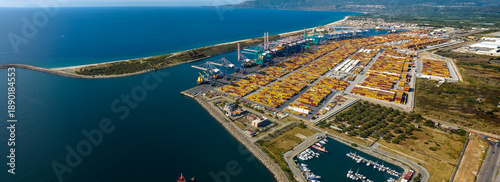 Aerial view of the industrial port of Gioia Tauro, located in the province of Reggio Calabria. It is the largest port in Italy by container throughput and the sixth largest in the Mediterranean Sea.