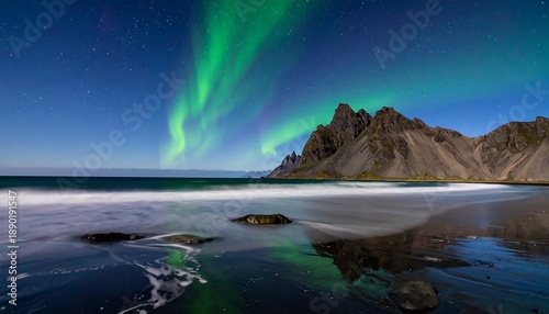Aurora borealis over ocean.
