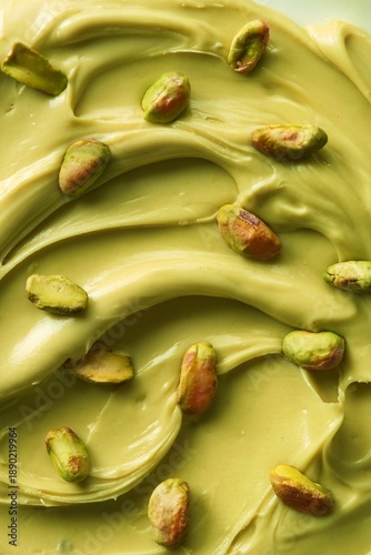 Pistachio cream spread with pistachio nuts over it. Full frame. Top view