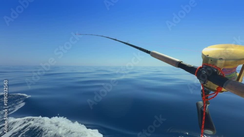 Offshore trolling fishing rod on boat in open sea