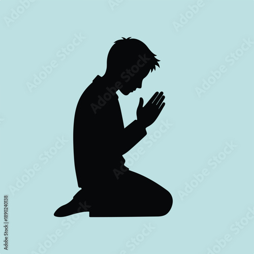 Silhouette of a Young Boy Kneeling in Prayer on a Light Blue Background
