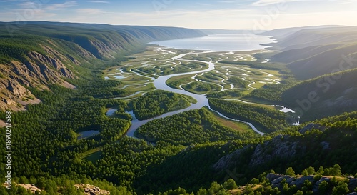 Stunning aerial landscape of a river delta in a lush green mountain valley.