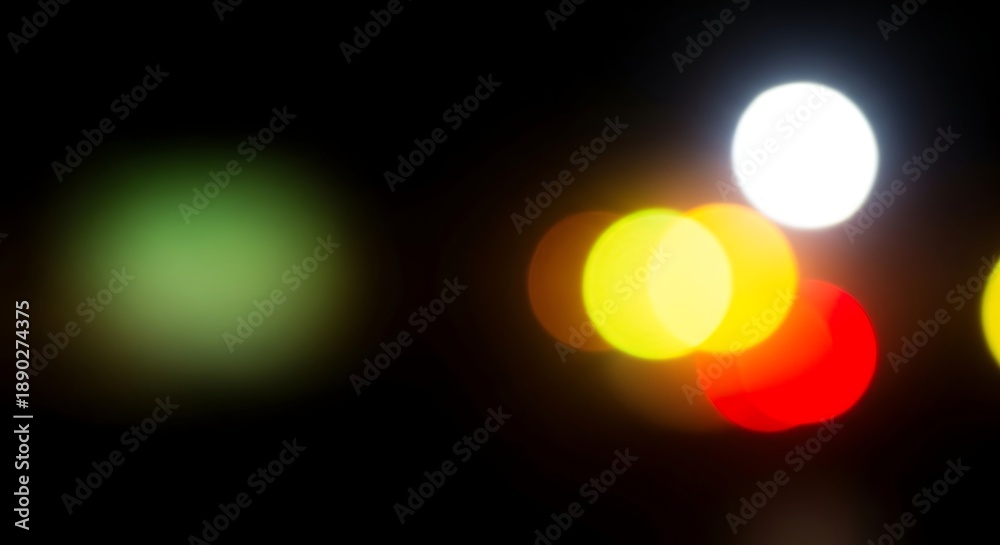 Fototapeta premium Colorful traffic lights blurry lights in the dark night