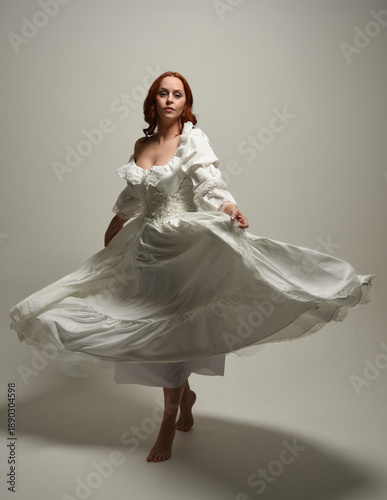 Φωτογραφία full length portrait redhead female model wearing historical fantasy wedding dress, fairytale ball gown