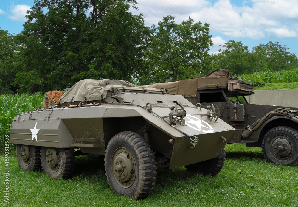 Fototapeta premium Military vehicle with a star on the front and a white stripe on the side