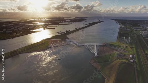 Aerial Drone View of Maeslantkering Storm Surge Barrier and Port of Rotterdam at Sunset, Netherlands