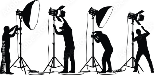 Silhouette photography studio crew adjusting professional lighting equipment with softboxes and spotlights during creative photoshoot setup isolated on white background for commercial stock imagery