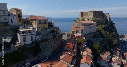Aerial view of the historic center of Scilla, in province of Reggio Calabria, Italy. It is a beautiful, small village located on a promontory overlooking the Mediterranean Sea. It is a summer morning.