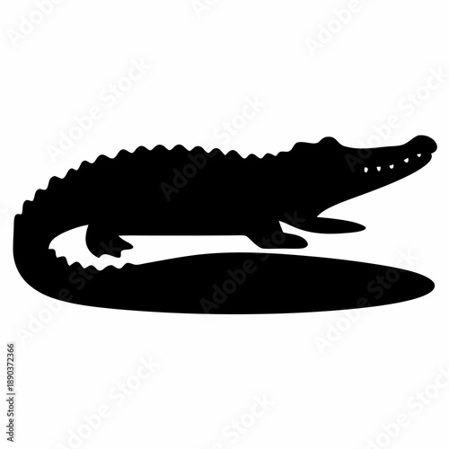 Monochrome silhouette of an alligator with a powerful tail and jagged back