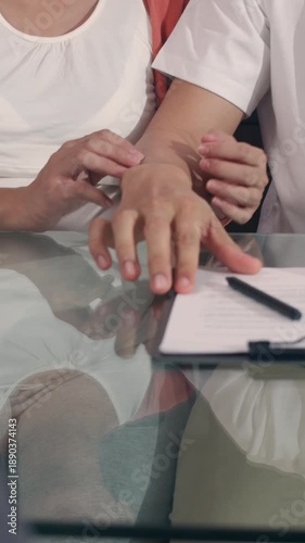 Vertical Screen : Young Asian Pregnant couple sign contract documents at home, Japanese family consulting with real estate financial advisor, Buying new house handshaking with broker in living room.