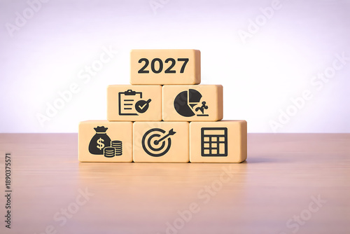 Business planning and financial growth concept for year 2027 with pyramid of money, chart, and target icons