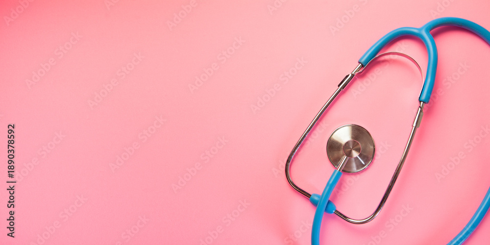 Fototapeta premium Stethoscope isolated on pink background. Health care and medical concept.