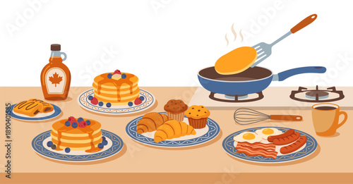 Breakfast food spread with pancakes and maple syrup