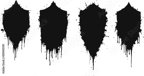 Four black grunge ink splash inkblot shapes with dripping paint isolated on white background
