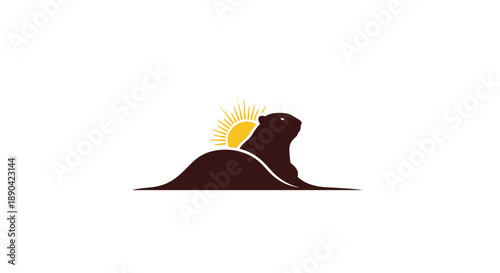 Simple silhouette of a seal or sea lion resting on land with a rising sun behind it.