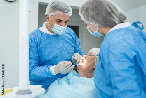  male dentist and nurse working with senior woman the clinic dentistry, healthcare people insurance