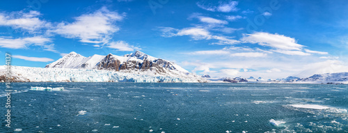 Panorama of the snow covered mountains and Kronebreen glacier, in Kongsfjord, Ny Alesund, Svalbard.