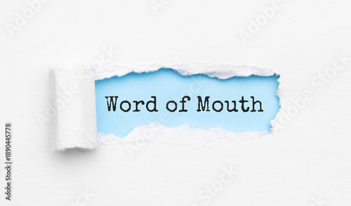 The text Word of Mouth appearing behind torn yellow paper
