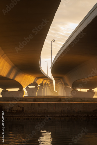 Golden Hour Glow Beneath Modern Bridge Structures