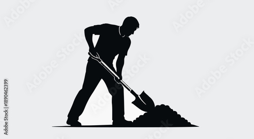 Silhouette of a man digging with a shovel in the dirt.