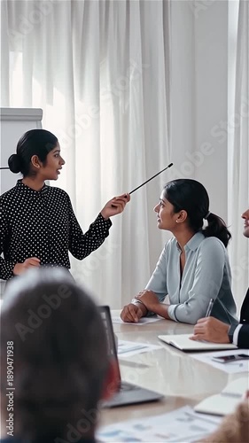 Young Indian Woman Presenting Business Strategy in Meeting - Professional Scene of Collaboration and Leadership