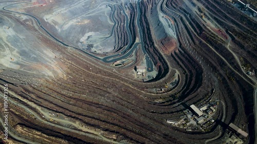 Iron ore mining, mineral deposits, excavation work, drone view.