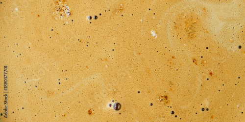 golden foam or cream texture on top of freshly brewed espresso coffee