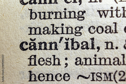 Fotografie Word cannibal printed on dictionary page, macro close up