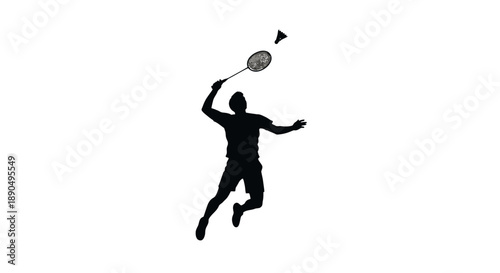Silhouette of a man jumping and playing badminton.