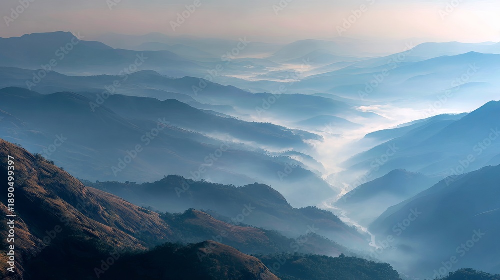 Fototapeta premium A serene mountain landscape with misty valleys and rolling hills at sunrise