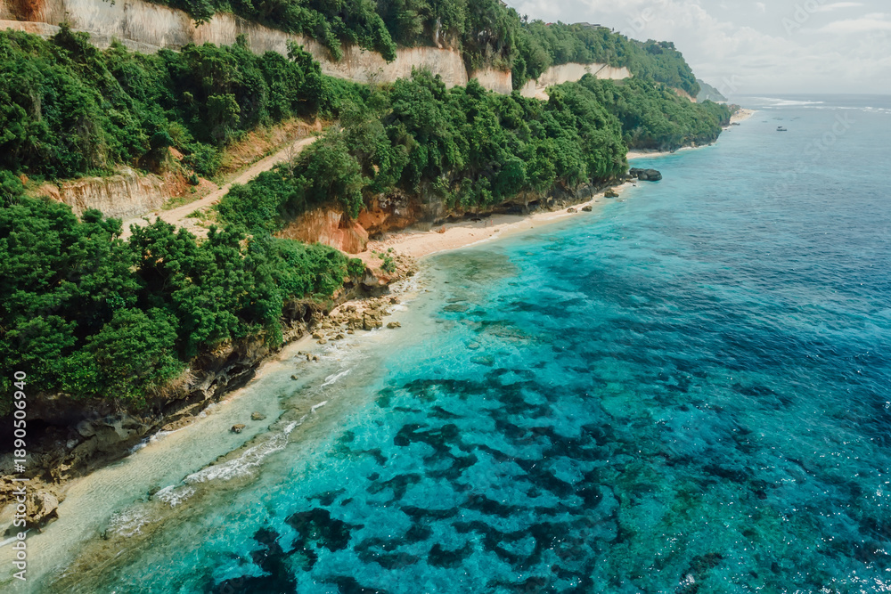 custom made wallpaper toronto digitalBeach under cliffs with quiet ocean in Bali. Aerial view