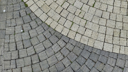 Vászonkép shot of curved cobblestone paving featuring contrasting light grey and dark char