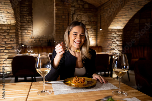 Woman enjoying a meal in a ...