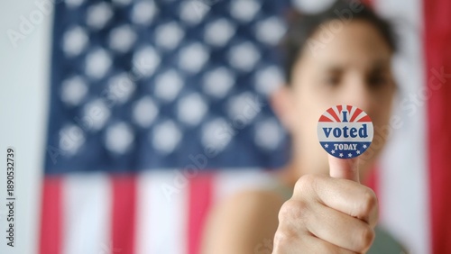 Tableau sur toile Woman showing i voted today sticker on finger, celebrating civic duty and patrio
