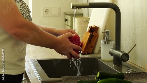 Woman washing vegetables before cooking
