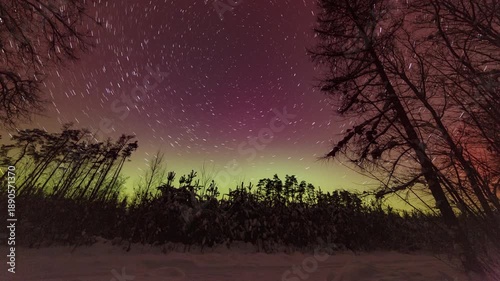 Startails and northern lights - 4k timelapse landscape.