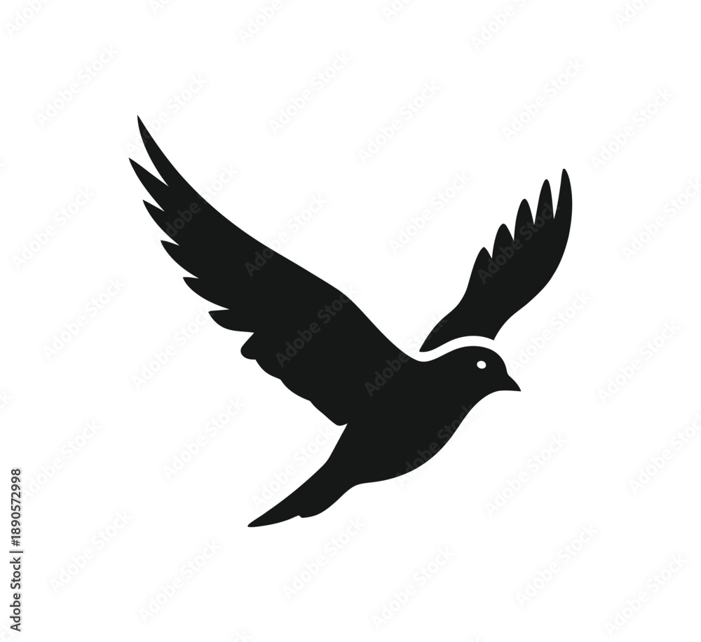 Obraz premium Black silhouette of a bird in mid flight with wings spread wide