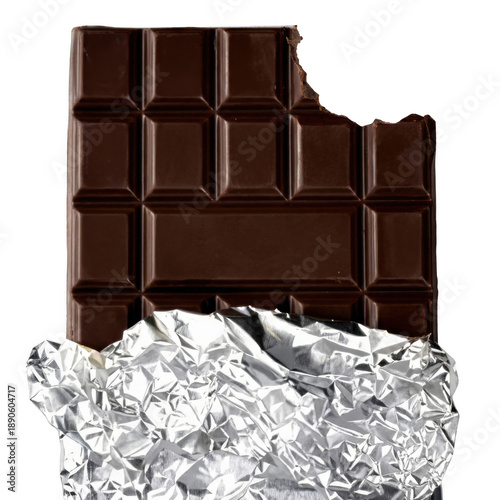 фотографія Bitten dark chocolate bar partially unwrapped showing silver foil on a dark sett