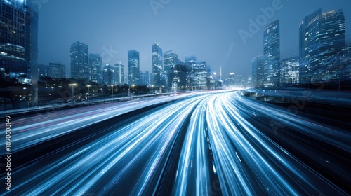 Bright city lights illuminate the skyline at night showcasing tall skyscrapers and dynamic traffic streams on a highway in a bustling urban environment.
