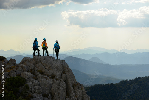 Trekking group exploring mountains in early morning light
